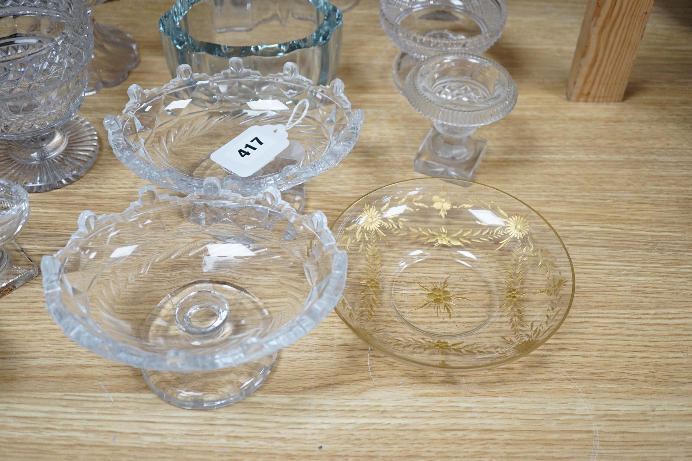 A collection of 19th century hobnail-cut salts, pots, jars and a pair of decanters, etched glasses, etc.